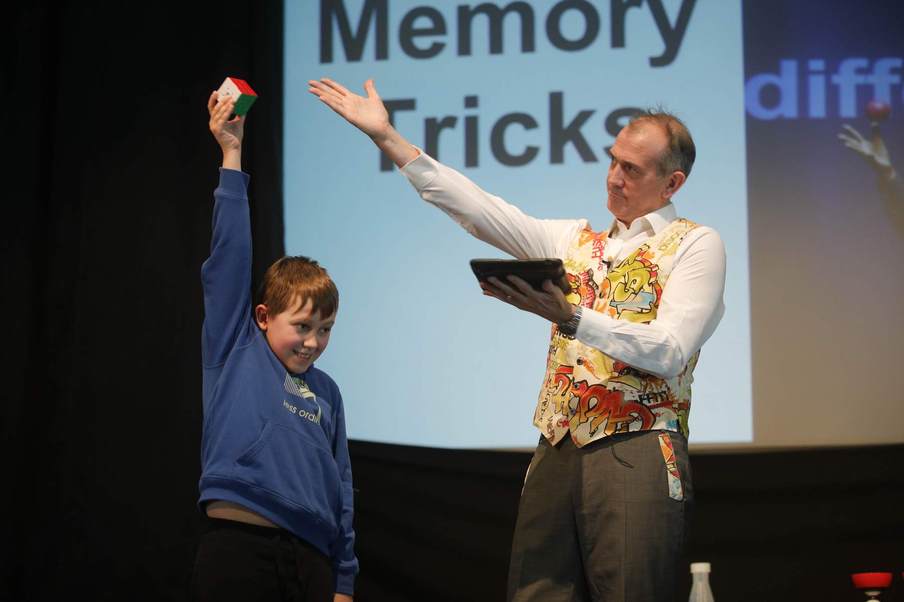 Student Volunteer finishes the Rubik's cube in under 2 minutes.