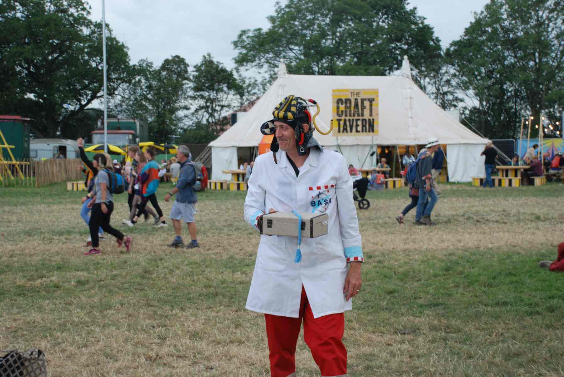 Dr Ken holds a small briefcase full of science experiments hidden from view.