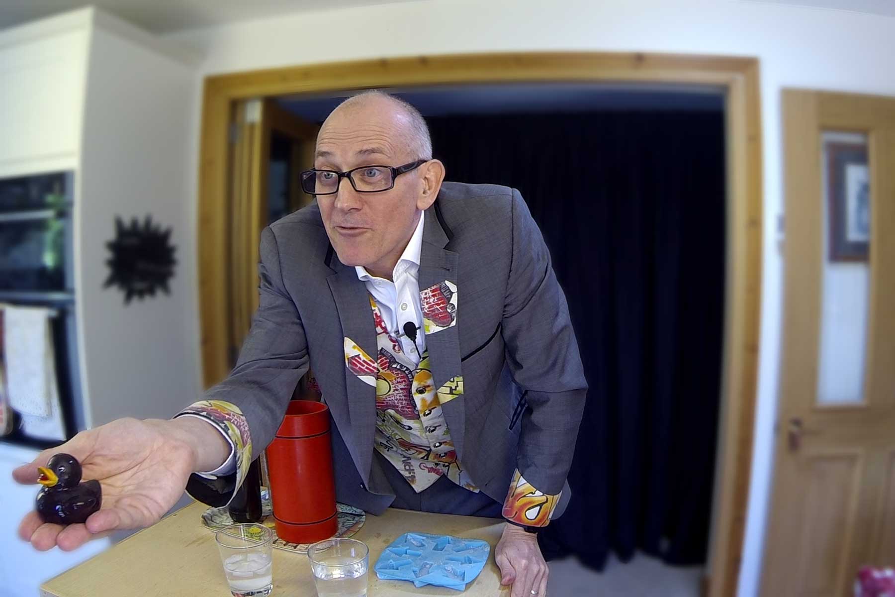 Dr Ken presenting his online science show from his lab kitchen into the classroom.