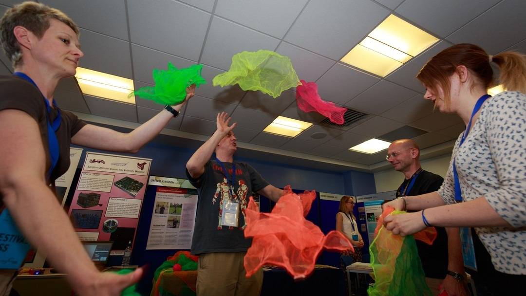 A group of Teachers learn to juggle with scarves and explore how air resistance really helps as the objects fall a lot slower.