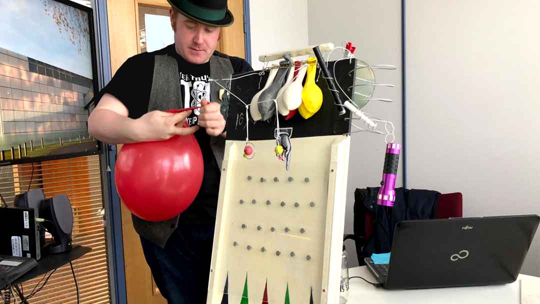 UEA Science Communication Student demonstrating their presentation props