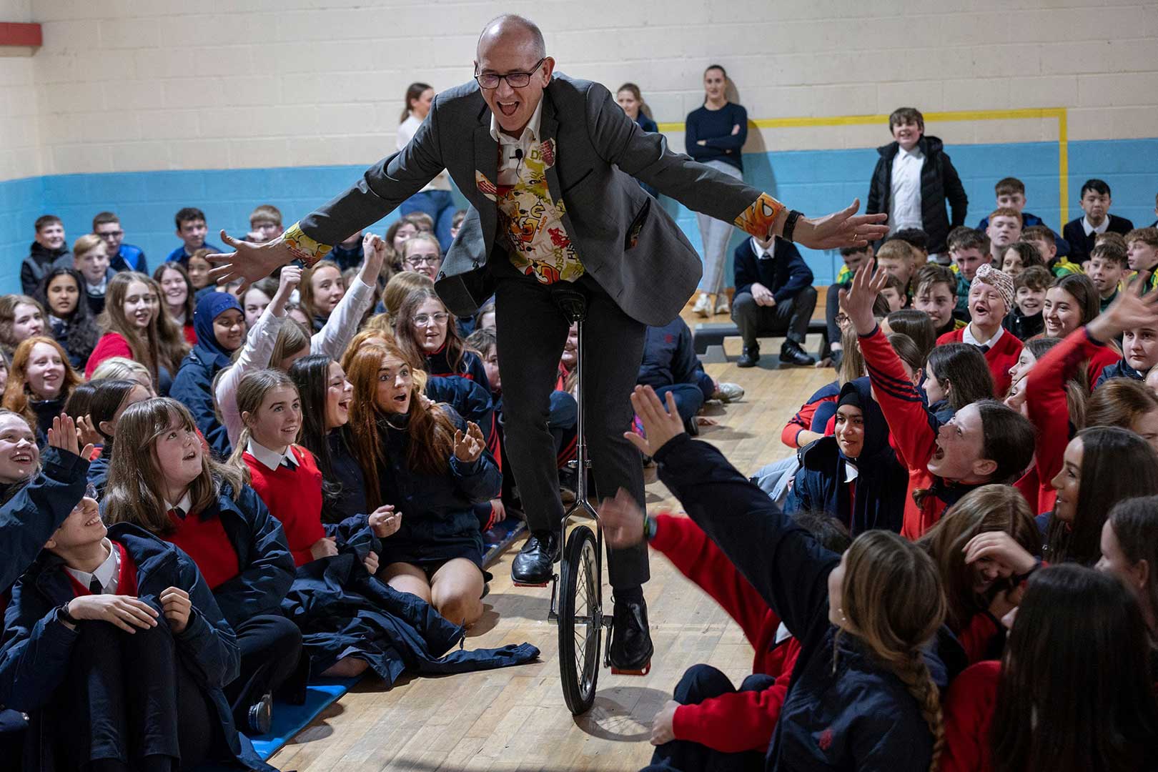 Dr Ken presenting the Science of Unicycling within the audience