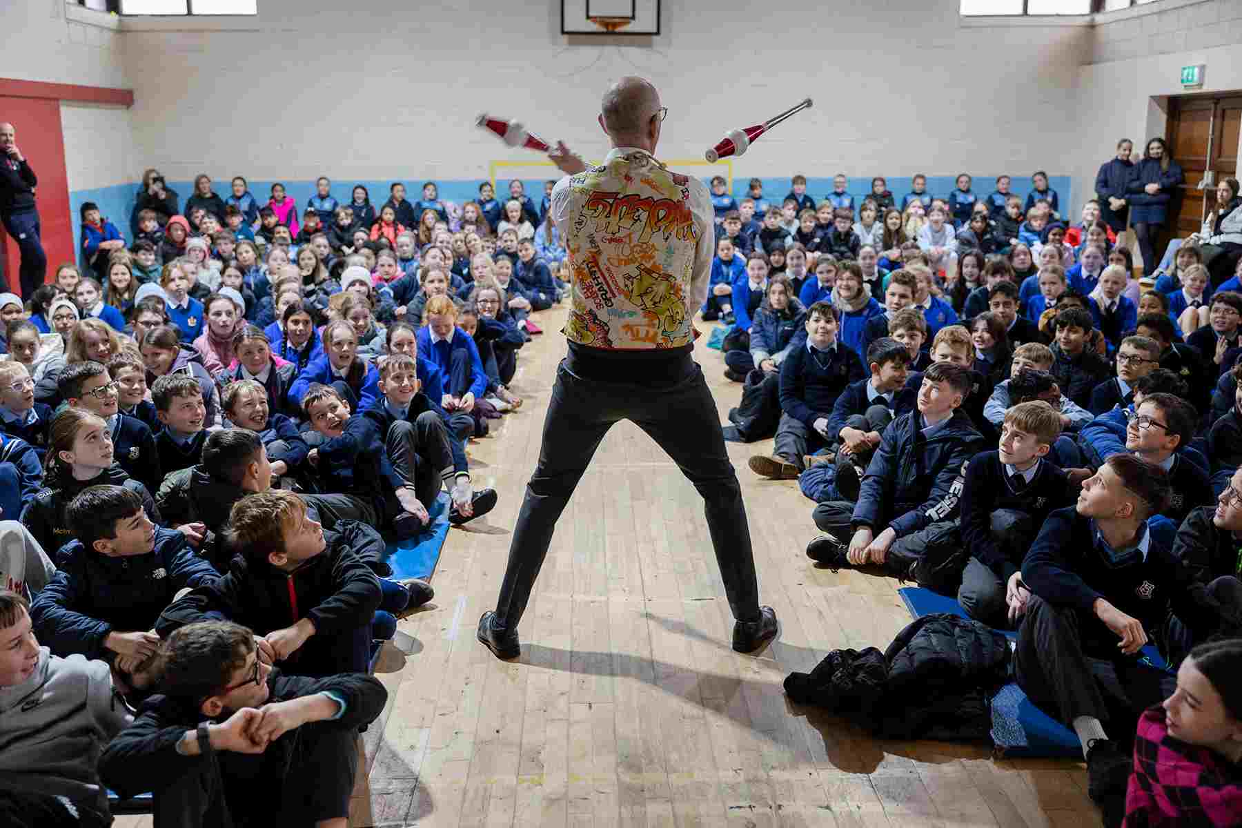Juggling Science week Circus science show for schools - the physics of juggling clubs for amazed high school pupils.