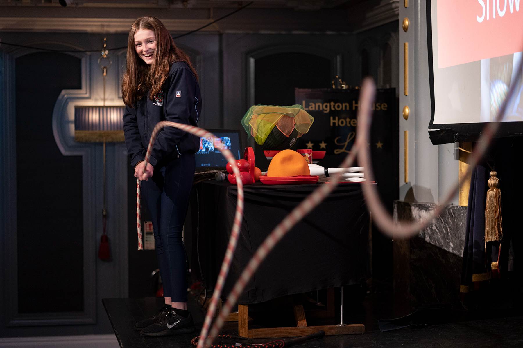 Science Week Circus Show Wave Demo Volutunteer demonstates the motion of sound waves using a long rope.